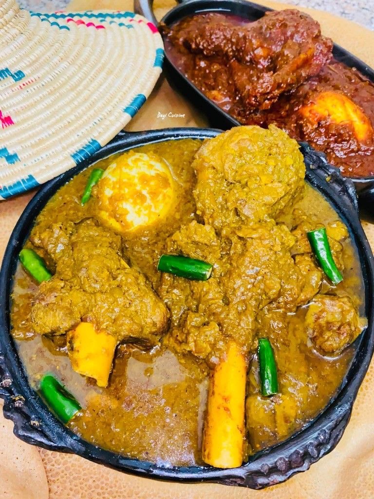 Ethiopian kikil wot, chicken and vegetables in a mild green herb sauce with boiled egg