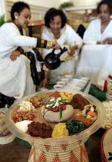 Traditional Ethiopian coffee ceremony with a jebena, roasted beans and small cups